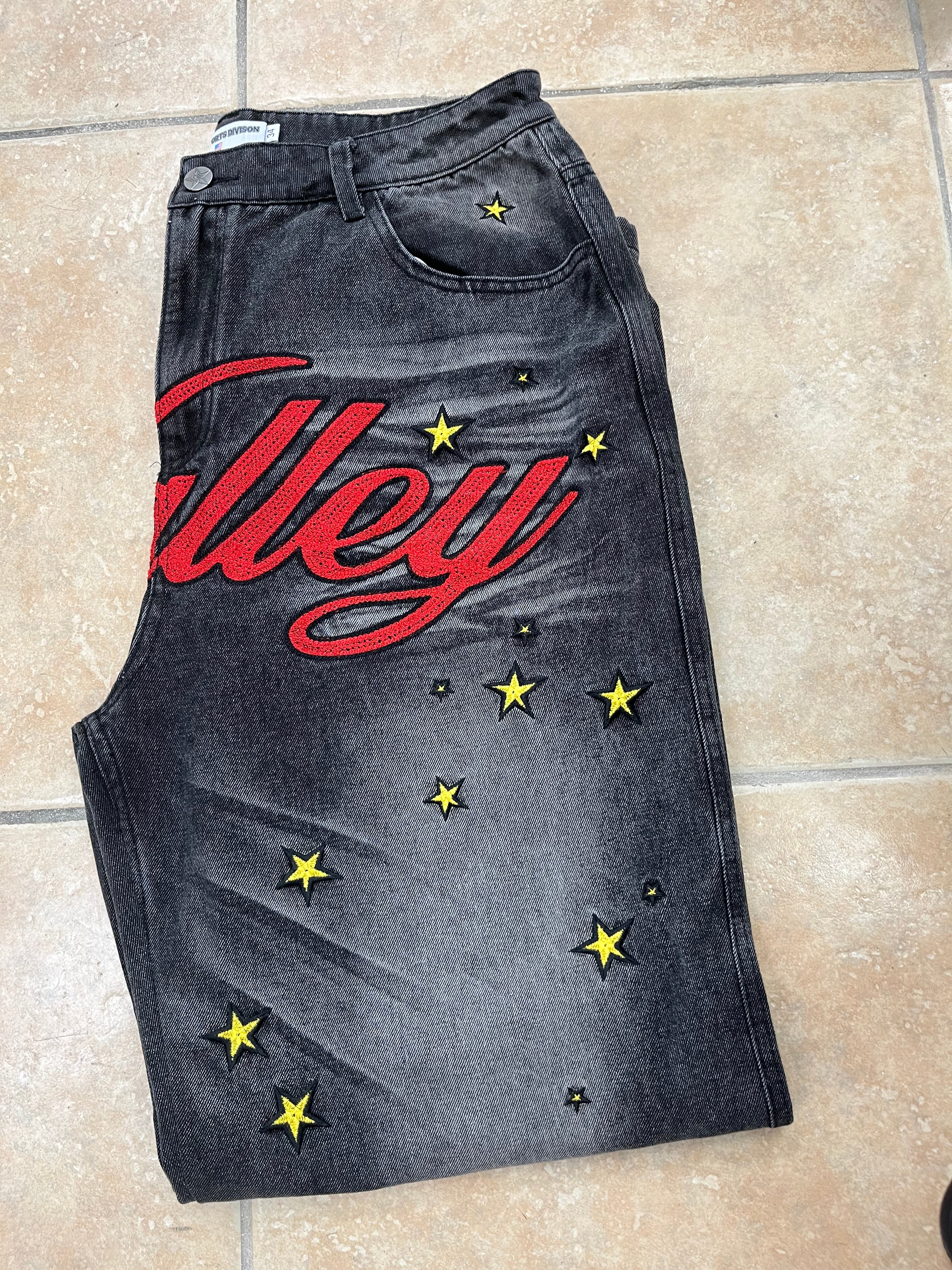 Vale lives jeans black red logo all over yellow stars